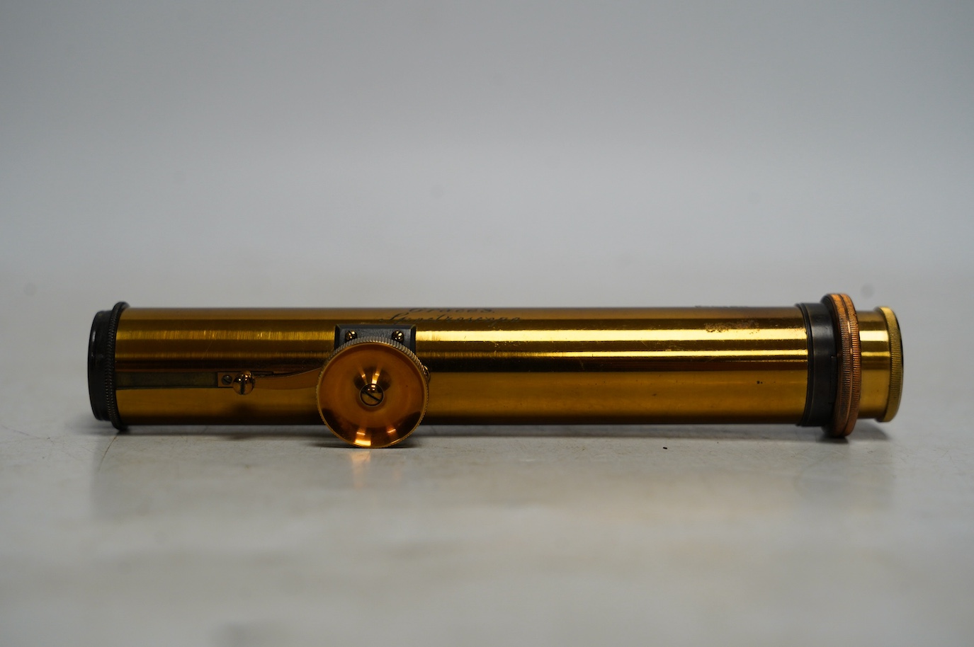 A late 19th century brass pocket spectroscope, engraved ‘Grace’s Spectroscope’, John Browning, 68, Strand, London, 14.5cm. Condition - fair